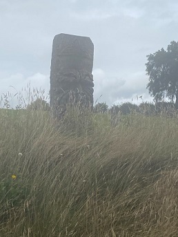  A stone monument in a field 